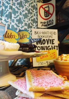 some food is sitting on a table with signs