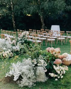 an outdoor ceremony set up with chairs and flowers