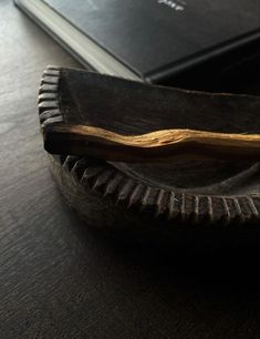 a book is sitting on top of a wooden plate