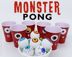 there are many cups with faces painted on them and the words monster pong in front of them