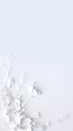 white paper cut flowers and birds on a white background