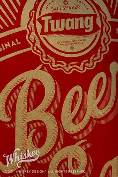 an advertisement for beer is shown on the side of a red bag with gold lettering