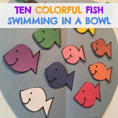 colorful fish swimming in a bowl made out of paper