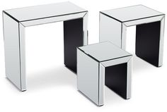 three mirrored side tables sitting next to each other