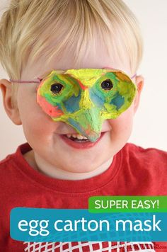 a young boy wearing an egg carton mask with the words super easy on it