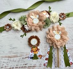 some paper flowers and ribbons on a table