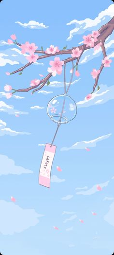 an image of a cherry blossom tree with a tag hanging from it's branch