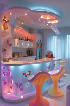 a brightly lit kitchen with butterfly decorations on the counter and stools in front of it