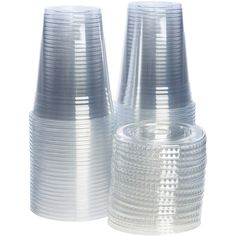 two clear plastic cups sitting next to each other on a white surface with no background