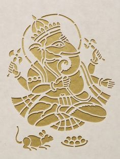 an intricately designed paper cut depicting the hindu god ganesha in gold and white