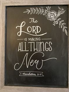 the lord is making all things new written on a chalkboard