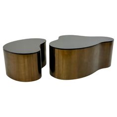 pair of brass and black glass coffee tables