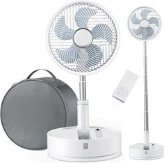 a white table top fan sitting on top of a stand next to a gray bag