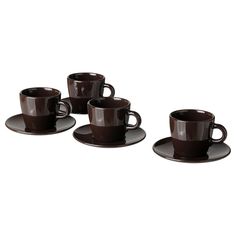 four coffee cups and saucers sitting on top of each other