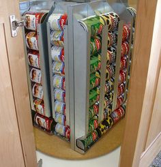 an open door to a pantry filled with cans