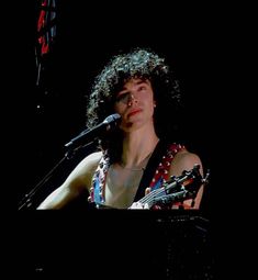 a man that is standing in front of a keyboard