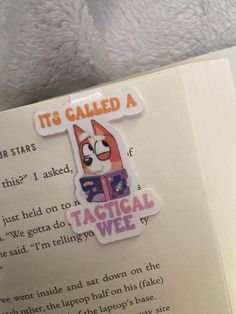 an open book with a sticker on it that says it's called a