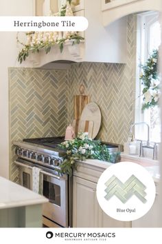 a white kitchen with herringbone tile on the backsplash and an oven hood