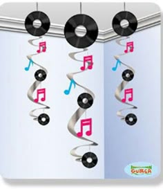 an image of musical notes hanging from the ceiling with vinyl record and tape on it