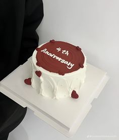 a white cake with red frosting and it's a birthday message on top