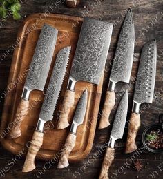 five knives on a cutting board with spices