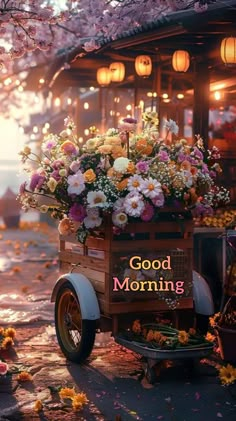 an old fashioned car with flowers in the back and good morning written on the side