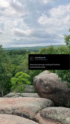 the tweet is posted to someone on top of some rocks in the woods