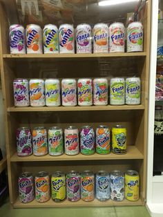 a shelf filled with lots of different flavored drinks