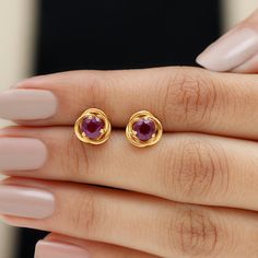 Product Details Designed with elegance, these Swirl Stud Earrings crafted in Solid Gold are Adorned with Round Cut Rhodolite Solitaire to complement your attire for special occasions. Product Information SKU SHP-EARRINGS062196639 Length 9 mm Width 9 mm Height 3.7 mm Weight 2.02 gm (Approximate) RHODOLITE INFORMATION No.of Stones 2 Pieces Total Weight 1.20 Carat (Approximate) Dimension(approx) Round-5X5 mm-2 Pcs Color Red Cut Brilliant Shape Round Setting Type Prong-Setting Quality Grade AAA View One Stone Earrings Gold, Stone Studs Earrings Gold, Earrings Gold Design, Earrings Design Gold, Gold Earrings Studs Simple, Simple Diamond Earrings, Real Gold Earrings, Antique Necklace Gold, Stone Earrings Studs