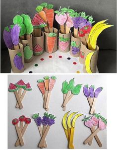 paper strawberries, carrots and bananas are on sticks