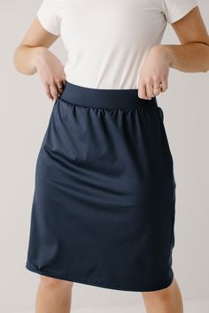 Looking for modest options to accompany your active lifestyle? We have you covered with our modest athletic skort! Our high quality, athletic skorts are cut and sewn right here in Lancaster County, Pennsylvania and have withstood even the most rigorous activities. With fitted knee length shorts sewn in at the elastic waistband, this skort will soon become your go to piece for your favorite sport or activity! Choose from several shades and stripe or no stripe! Made with a moisture-resistant, medi Navy Stretch Activewear With Elastic Waistband, Athleisure Solid Swim Skirt With Elastic Waistband, Navy Stretch Casual Skort, Short Sew In, Athletic Skirts, Modest Girl, Modest Clothing Women, Athletic Skort, Knee Length Shorts