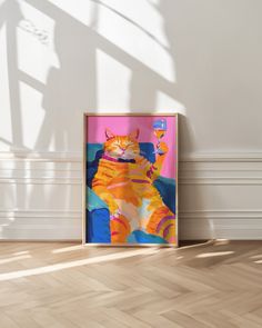 an orange and white cat sitting on top of a wooden floor next to a wall