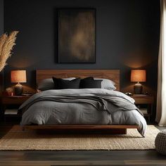 a bedroom with black walls and wooden furniture, including a bed that is made up in grey linens