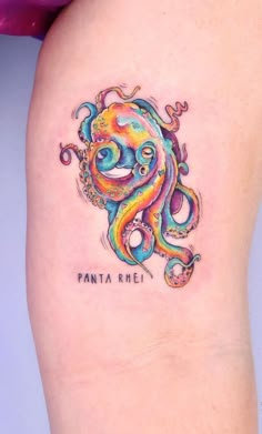 an octopus tattoo on the right thigh with words written below it that says,'fanta riel '