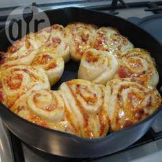 a pan filled with food sitting on top of a stove