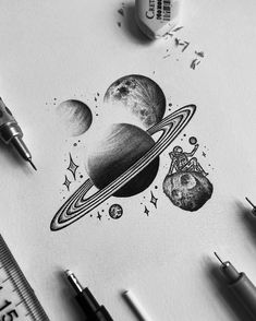 a pencil drawing of saturn and its satellites