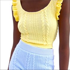 Nwt Zara Yellow Ruffled Cable Knit Top -Sleeveless Round Neck Top -Knit Woven Pattern On Front And Back -Crop Top With Ruffle Trim -Soft Feel Fabric -Materials: 99% Polyester, 1% Elastane -Size: Large -Color: Yellow -Measurements: **Please Also See Photos For Best Accuracy -Items Come From A Smoke Free And Pet Free (Unfortunately) Home -Please See My Other Matching Items For Combined Shipping And Savings !! Fitted Yellow Knit Top, Stretch Yellow Knit Top, Yellow Sleeveless Sweater Vest For Spring, Casual Yellow Knit Sweater Vest, Trendy Yellow Knit Top, Sleeveless Cable Knit Summer Tops, Sleeveless Cable Knit Tops For Summer, Casual Yellow Sleeveless Knit Top, Summer Yellow Knit Top