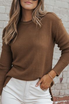 Details You can do so much with a solid ribbed sweater for the fall! Features for our Brown Long Sleeve Ribbed Sweater include a crew neckline, ribbed detailing, side slits, and waffle texture fabric construction. Style it with denim jeans or pants with trendy loafers and a simple crossbody to complete the look. Long sleeve Dropped shoulder Crew neckline Ribbed detail Side slits High low hem Waffle texture 100% Acrylic Hand wash cold Lay flat to dry Color: Brown Colors may vary on different view Trendy Loafers, Texture Fabric, Fabric Construction, Brown Long Sleeve, Fall Collection, Brown Sweater, Fall Collections, Ribbed Sweater, High Low Hem