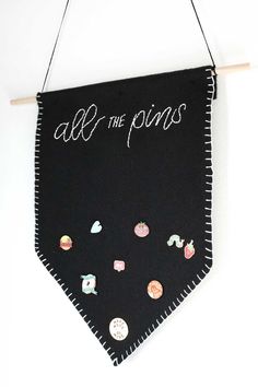 a black banner hanging on the wall with buttons