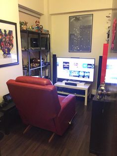 a living room filled with furniture and a flat screen tv on top of a wooden floor