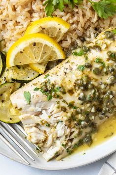 baked mahi mahi with lemon and parsley on the side, served over rice