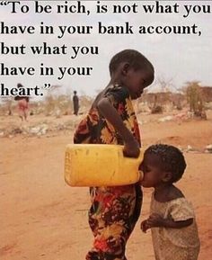 two children are standing in the dirt and one is holding a yellow container with water on it