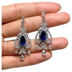 The Following Item we are offering is a Rare Important Radiant 18KT Gold Large Rare Fancy Blue Ceylon Sapphire and Diamond Earrings. Earrings are comprised of Gorgeous Ceylon Blue Sapphires Spectacularly Set in and surrounded by Magnificent Glittering Fancy Cut Diamonds!!! T.C.W. approx 15CTS!!! These Gorgeous Earrings are a Rare Sample Pair from a Private Manufacturer that sold to Important 5 Star Hotel and Fine Jewelry Stores and comes Brand New With Tags $170,000. Elegant Luxury Jewelry With Lab-created Sapphire, Luxury Sapphire Fine Jewelry, Luxury Exquisite Gemstone Earrings, Sapphire Aesthetic, Expensive Earrings, Dark Blue Earrings, Navy Blue Earrings, Rare Jewelry, Sapphire And Diamond Earrings