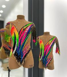 two mannequins with colorful designs on them