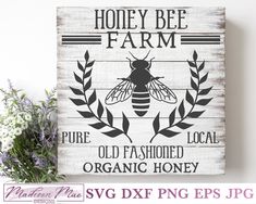 a wooden sign that says honey bee farm with an image of a bee on it