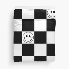 a black and white checkerboard pattern with smiley faces on it duvet cover