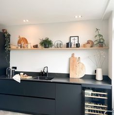 the kitchen is clean and ready to be used for wine tasting or as an appetizer