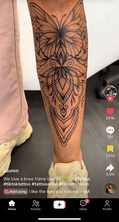 a person's leg with a tattoo on it and an image of a butterfly