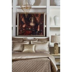 a bed sitting under a painting on top of a white book shelf next to a lamp