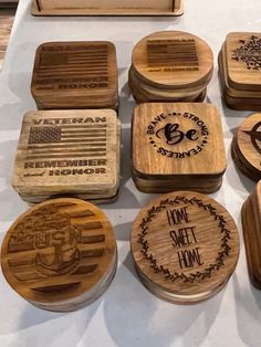 several wooden coasters with the words home sweet home and american flag designs on them